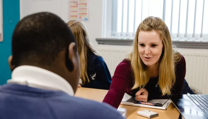 A tutor explains a concept to a pupil