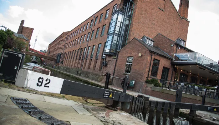 a view of Manchester lock 92 and a converted factory in the background