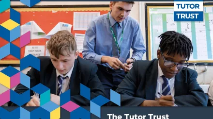 The cover of Tutor Trust's 2023 Impact Report. A young male tutor wearing a blue shirt and tie is stood to the back of two secondary-aged male pupils wearing school uniform. At the bottom and to the side of the image are decorative patterns.