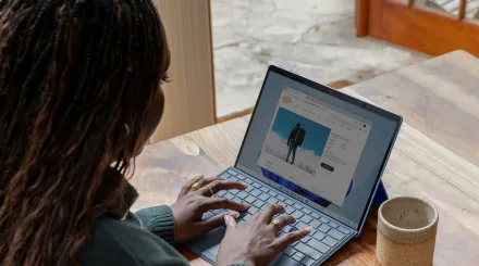 woman working on a laptop at her table