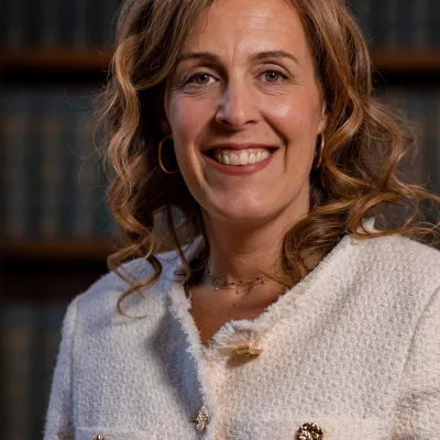 Co-Founder and Executive Director of Tutor Trust, Abigail Shapiro, is photographed at the Trust's annual Summer Reception, smiling as she celebrates another successful year with stakeholders.  