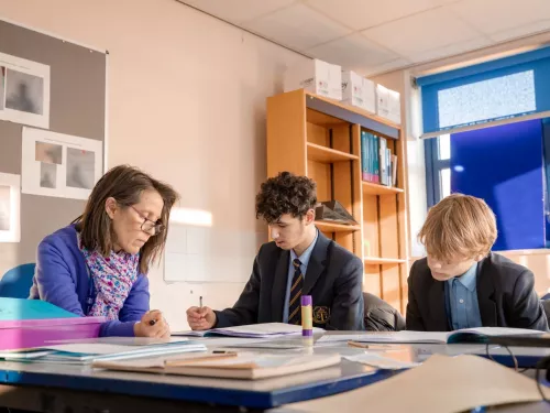 A tutor supports two Year 11 pupils with their Maths