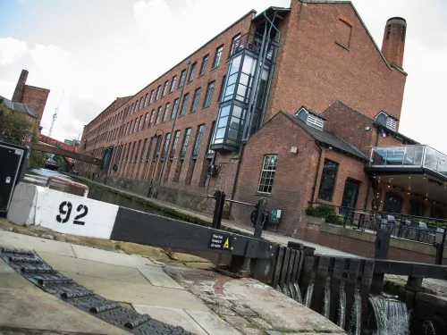 a view of Manchester lock 92 and a converted factory in the background
